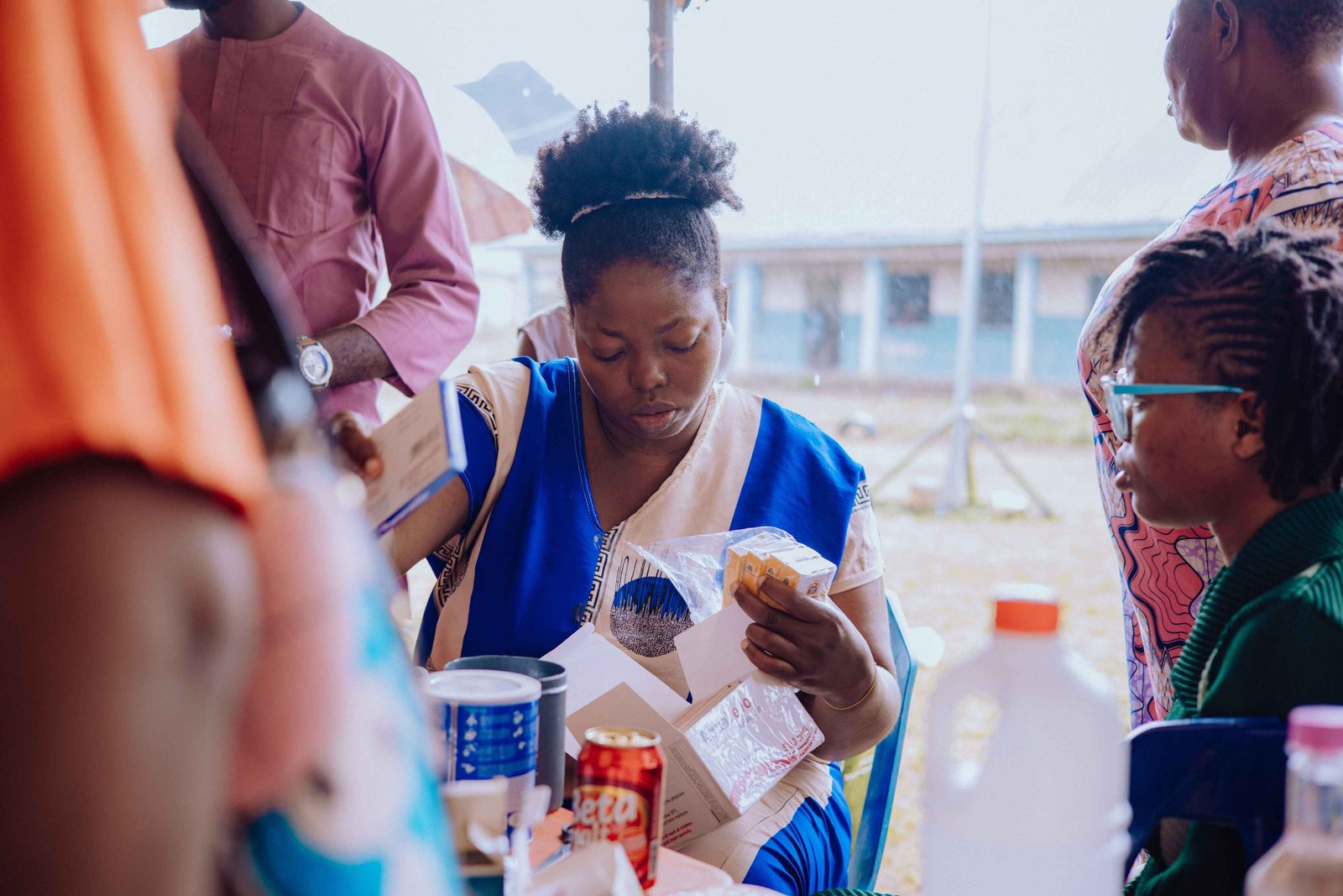 Medical volunteers and pharmacists dispensing free prescription medications